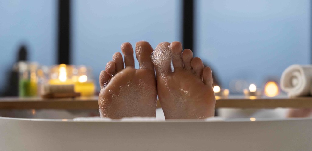 woman-keeping-her-feet-water-while-taking-bath2.jpg